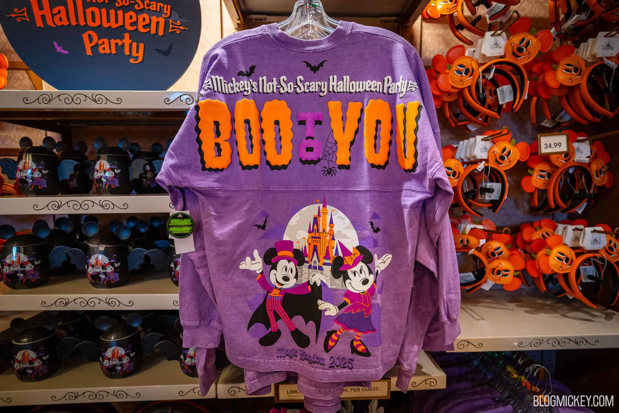 Purple Halloween-themed spirit jersey featuring Mickey and Minnie Mouse with a castle background and "Boo To You" written on it