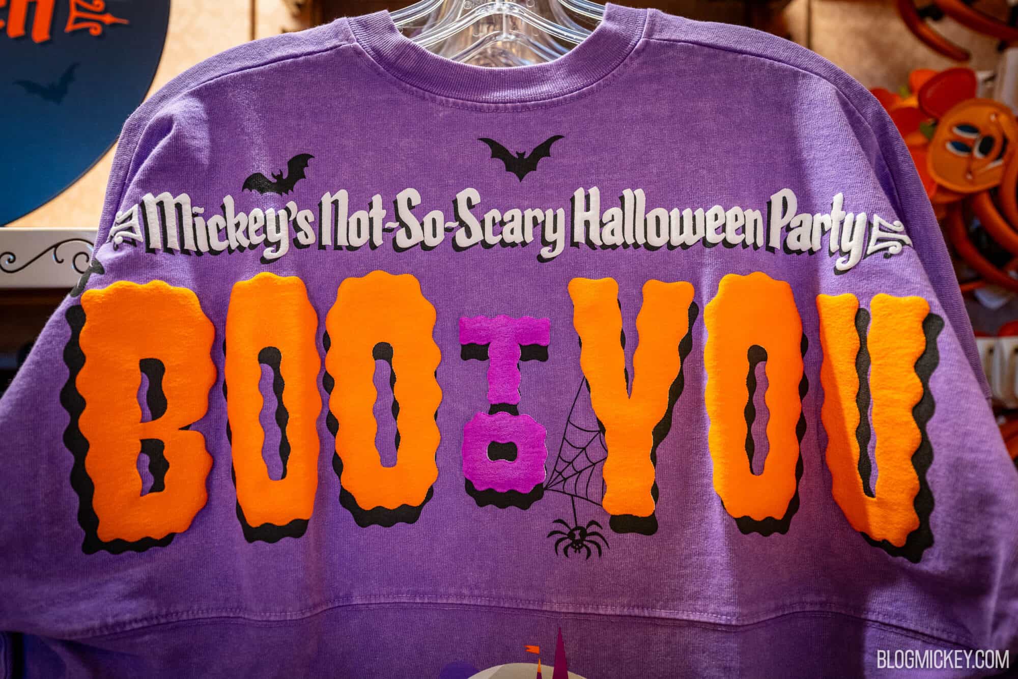 Purple Halloween-themed spirit jersey featuring Mickey and Minnie Mouse with a castle background and "Boo To You" written on it