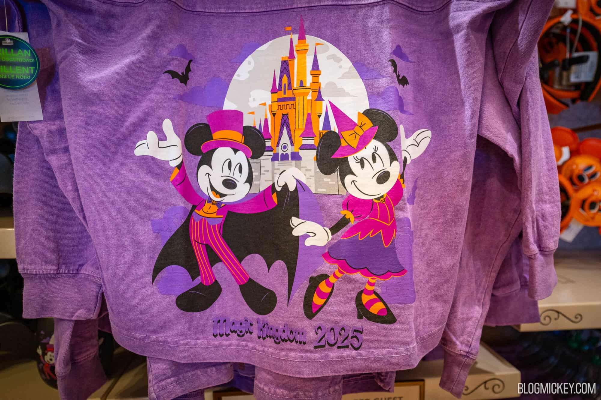 Purple Halloween-themed spirit jersey featuring Mickey and Minnie Mouse with a castle background and "Boo To You" written on it