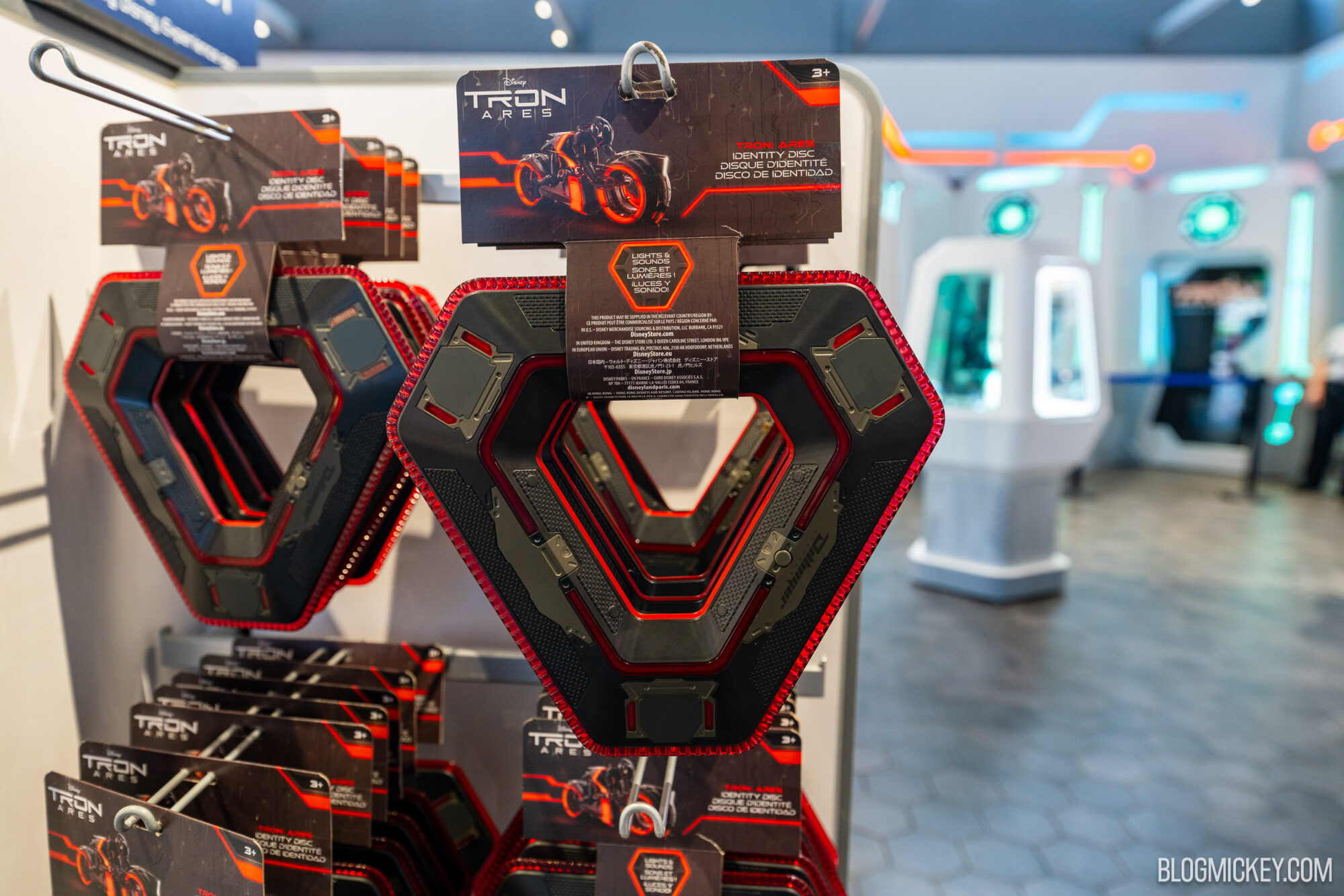 Red and Black triangular Tron-themed identity discs on display at Disney World