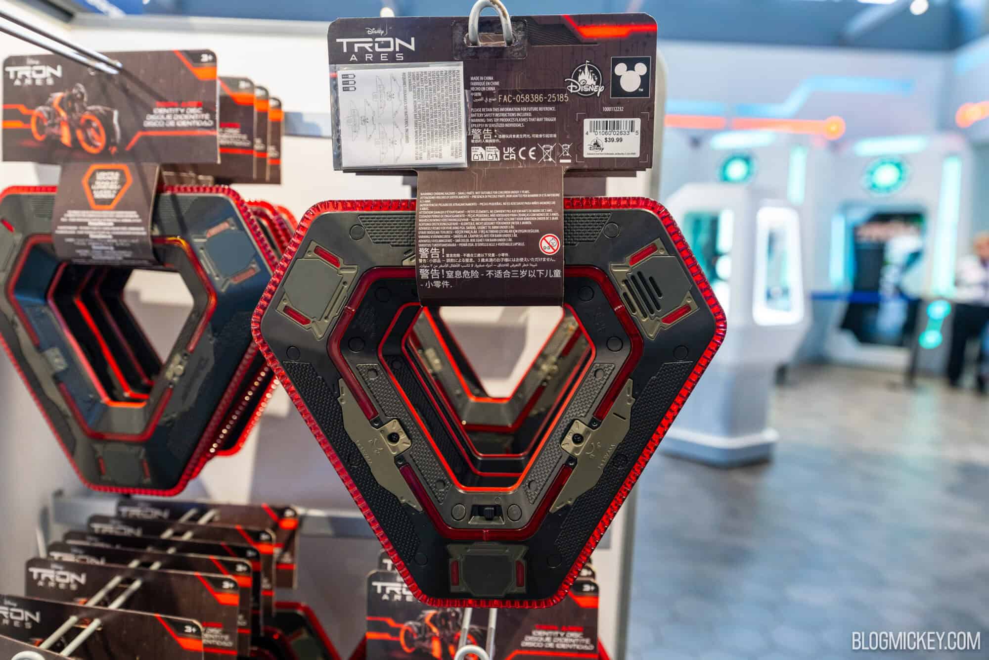 Red and Black triangular Tron-themed identity discs on display at Disney World