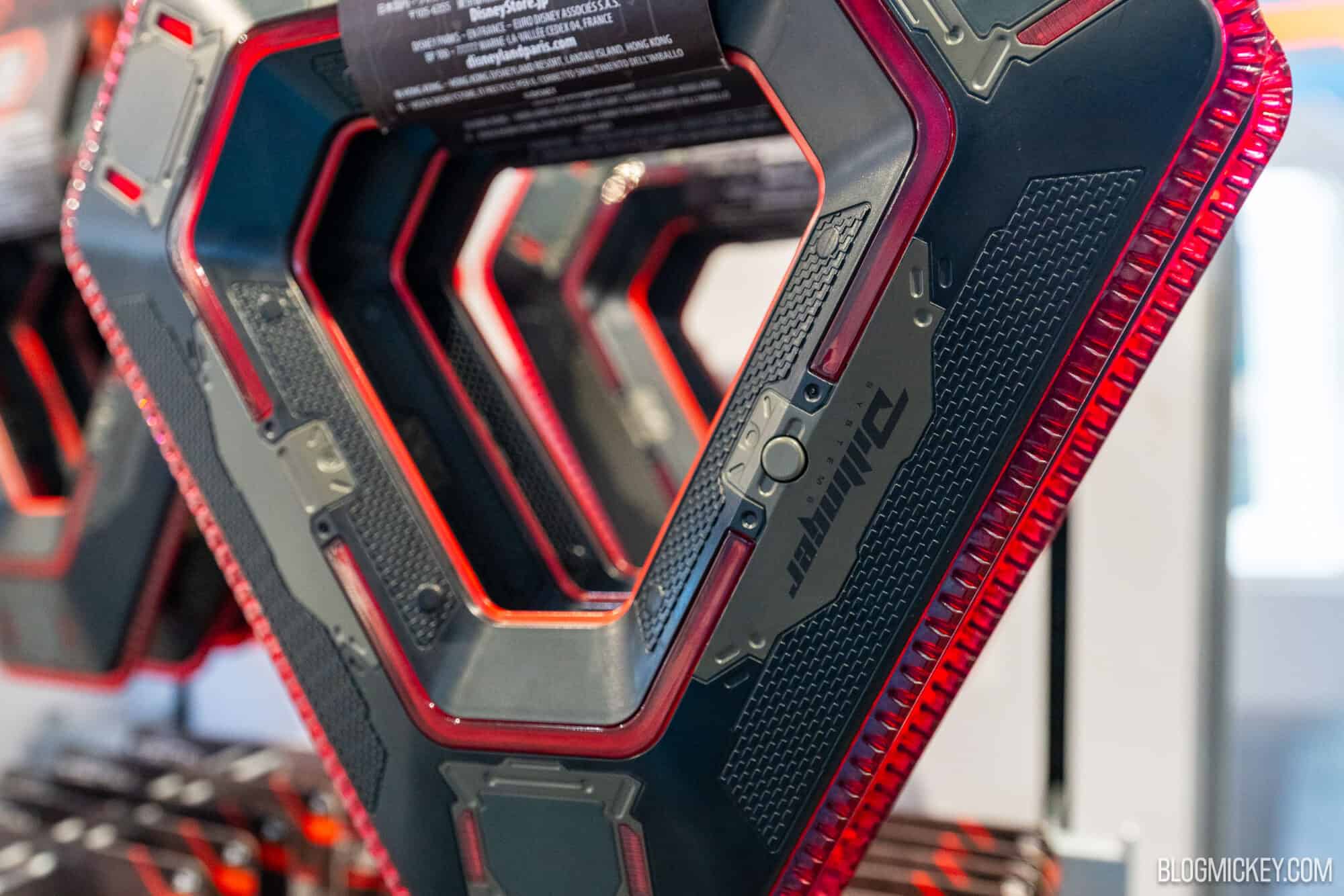 Red and Black triangular Tron-themed identity discs on display at Disney World