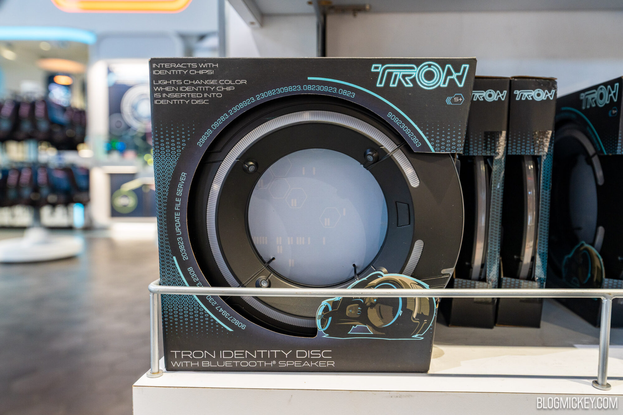 Custom Tron identity disc with Bluetooth speaker on display at a store.