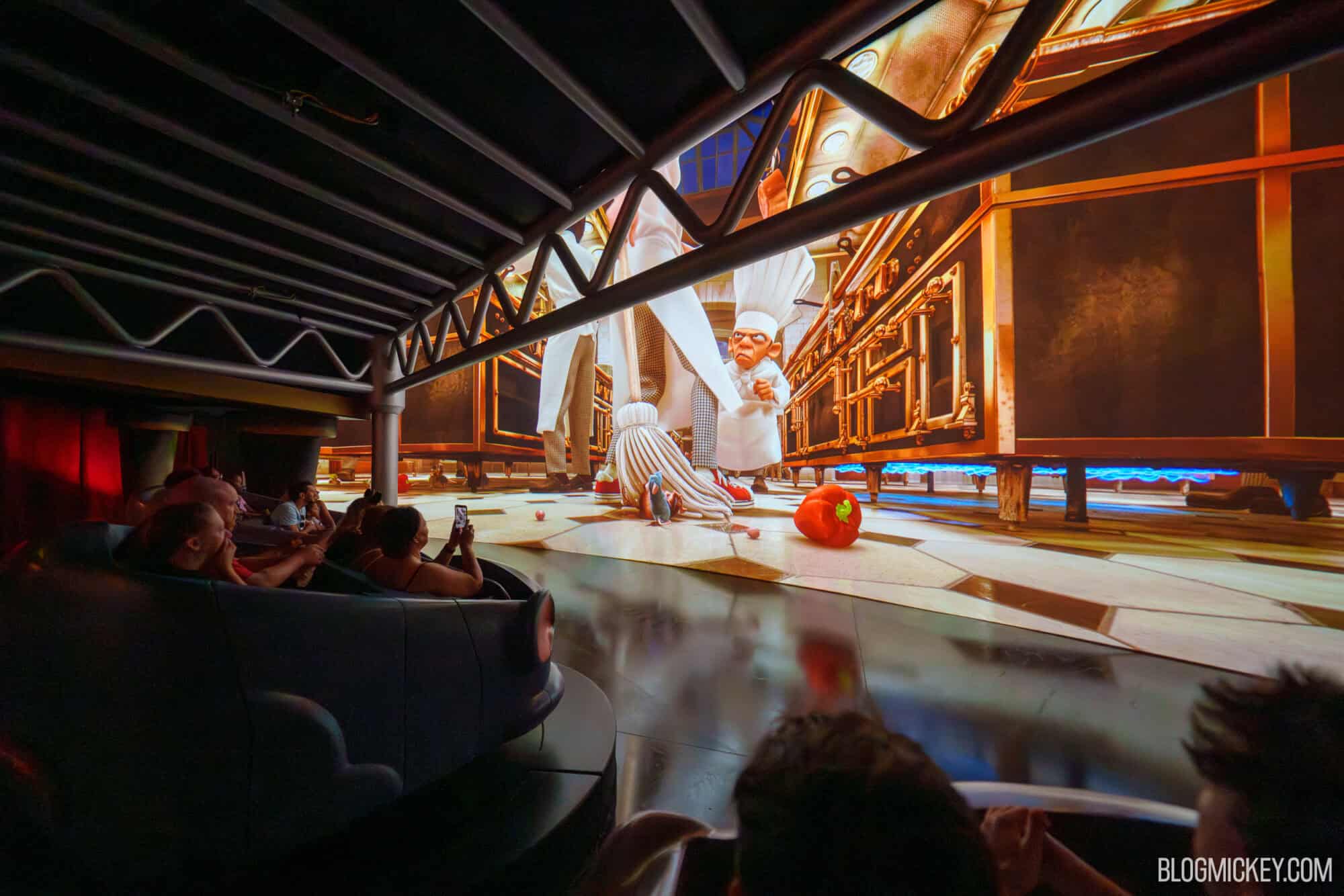 Guests watching Remy's Ratatouille Adventure ride at Disney World with props removed.