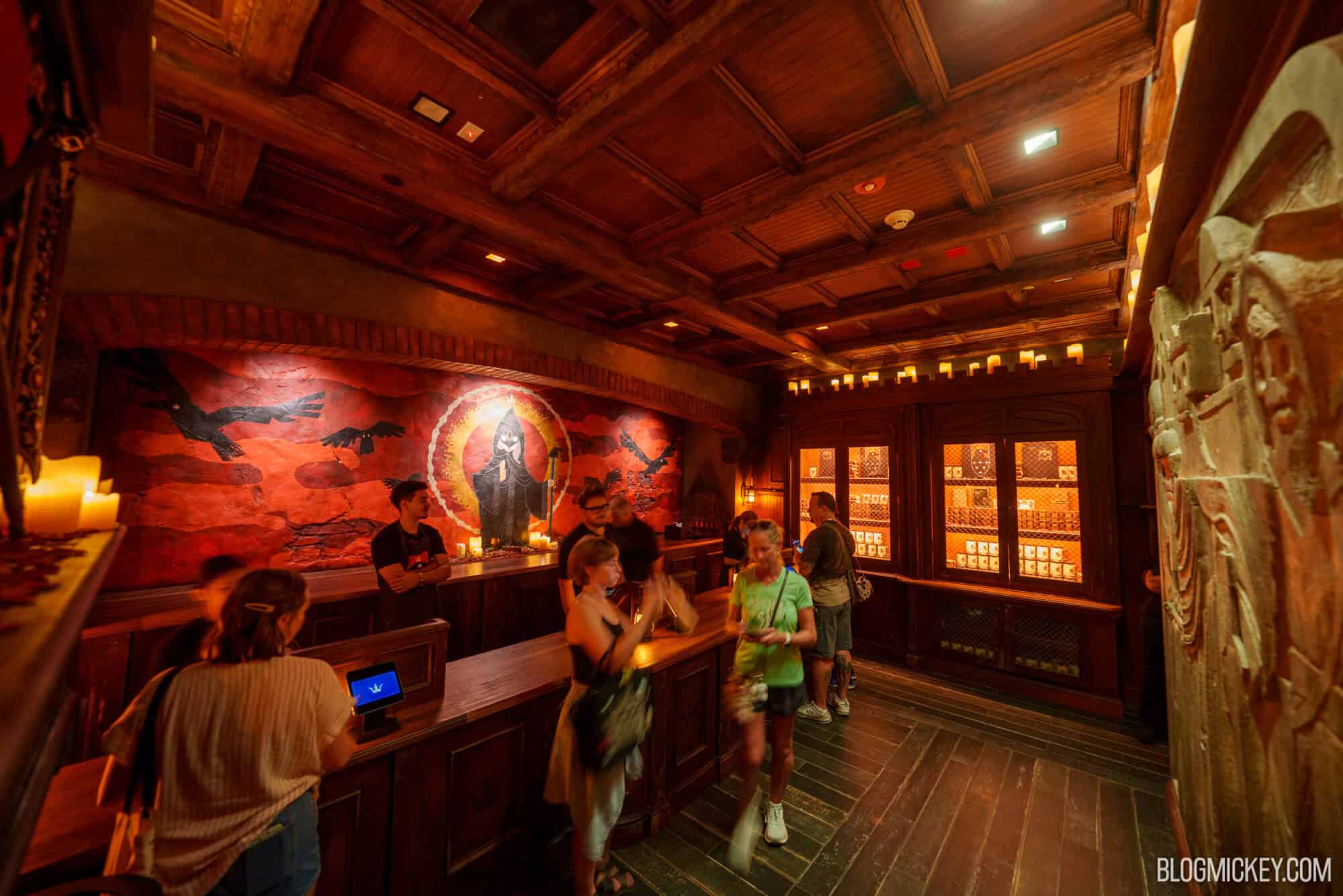 Guests at Disney Springs enjoy the Six Ravens themed area with detailed decor.