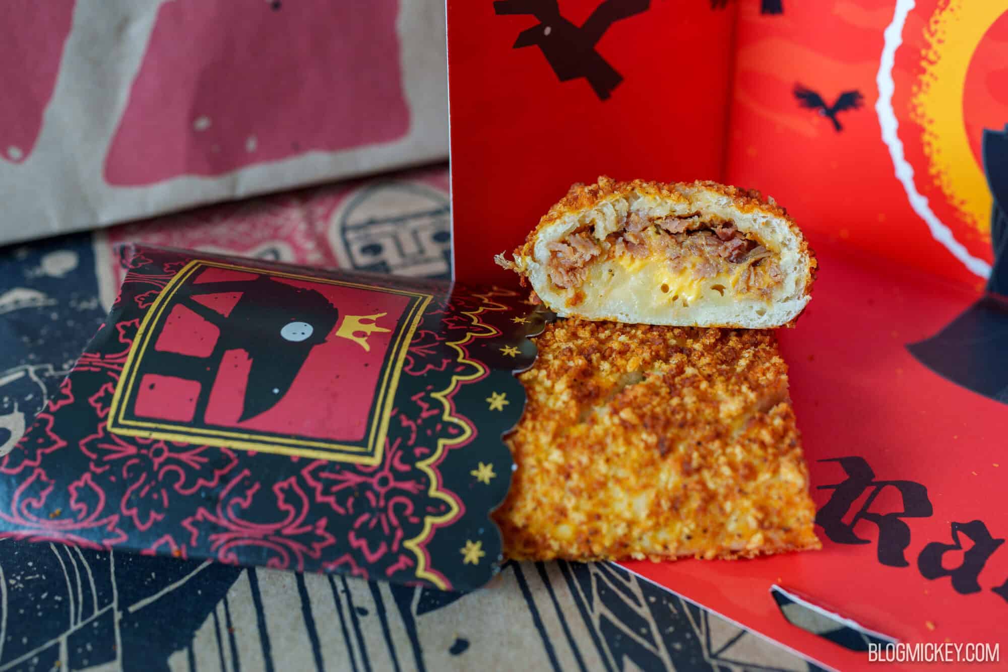 Close-up of a crispy snack with melted cheese at Disney Springs.