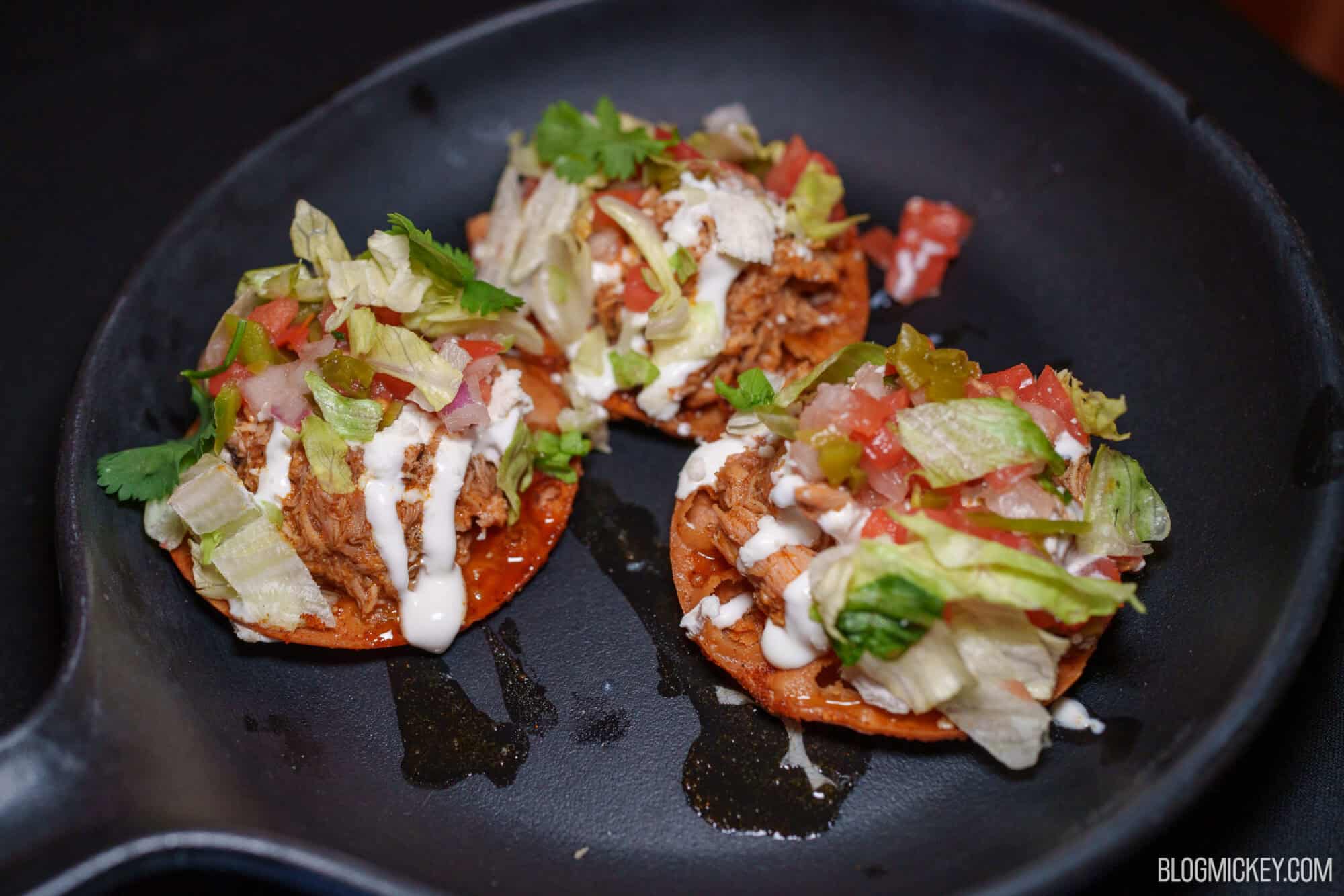 Delicious tacos with lettuce, tomato, and sauce at Magic Kingdom.