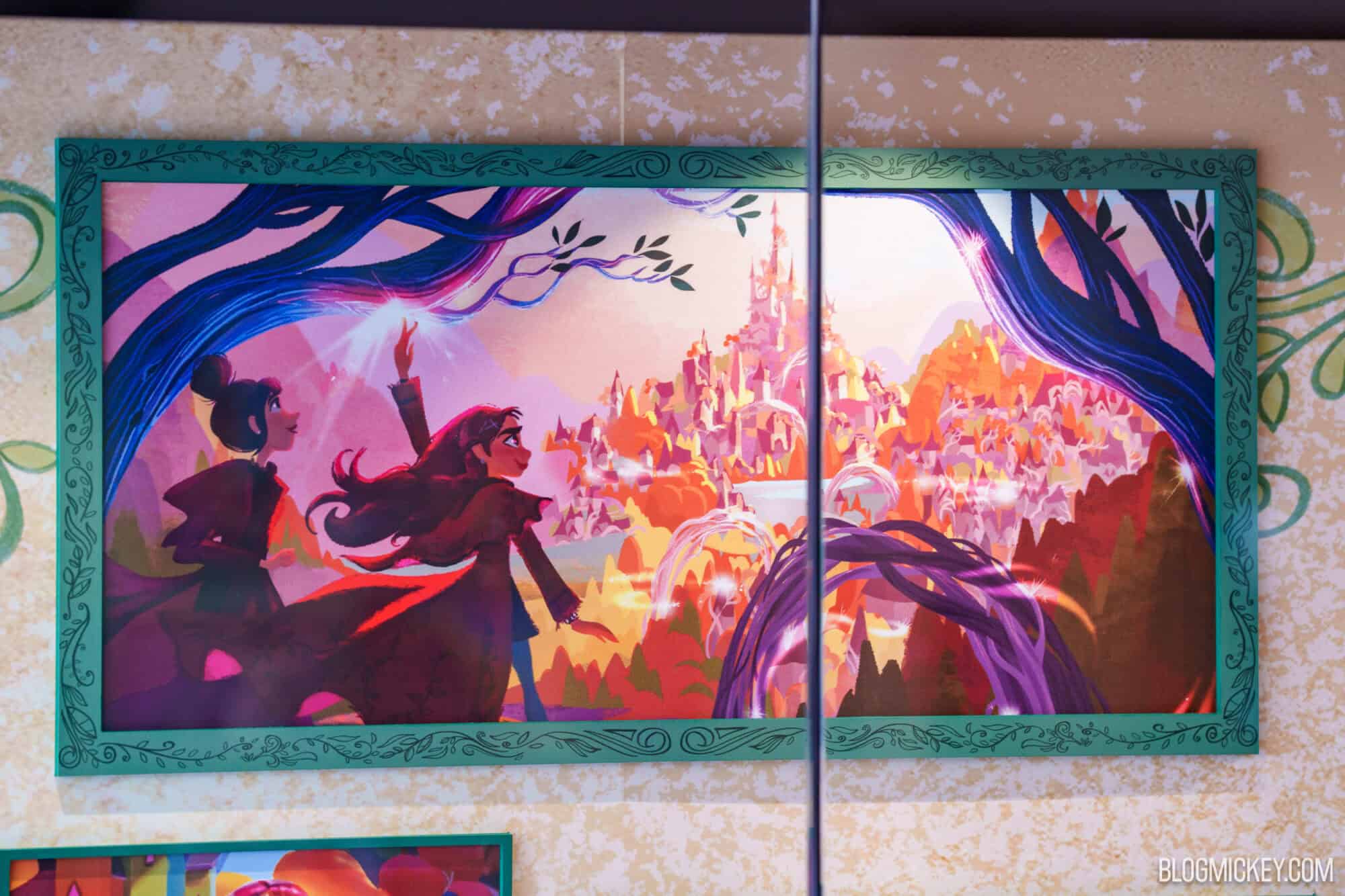Disney character maquettes and concept art shown in a framed mural at Hollywood Studios.
