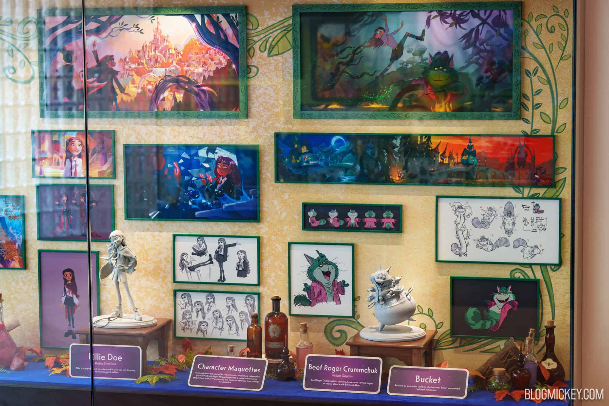 Display of character maquettes and concept art at Hollywood Studios.