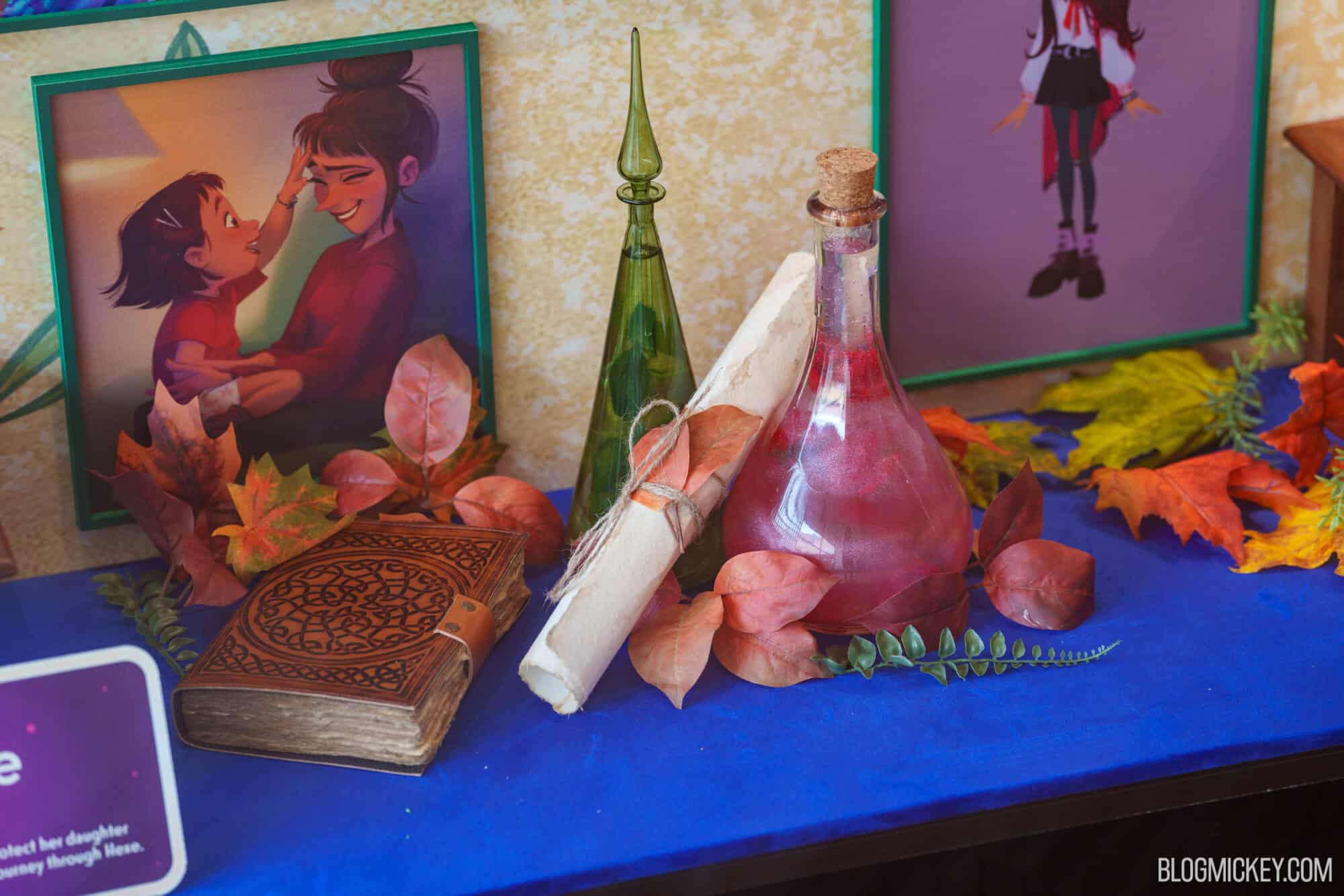 Disney character maquettes and concept art on display in Hollywood Studios showcase.