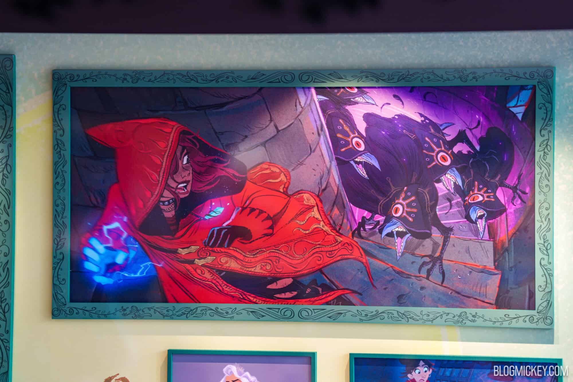 Disney Hexed character maquettes on display with red cloak and glowing magic.
