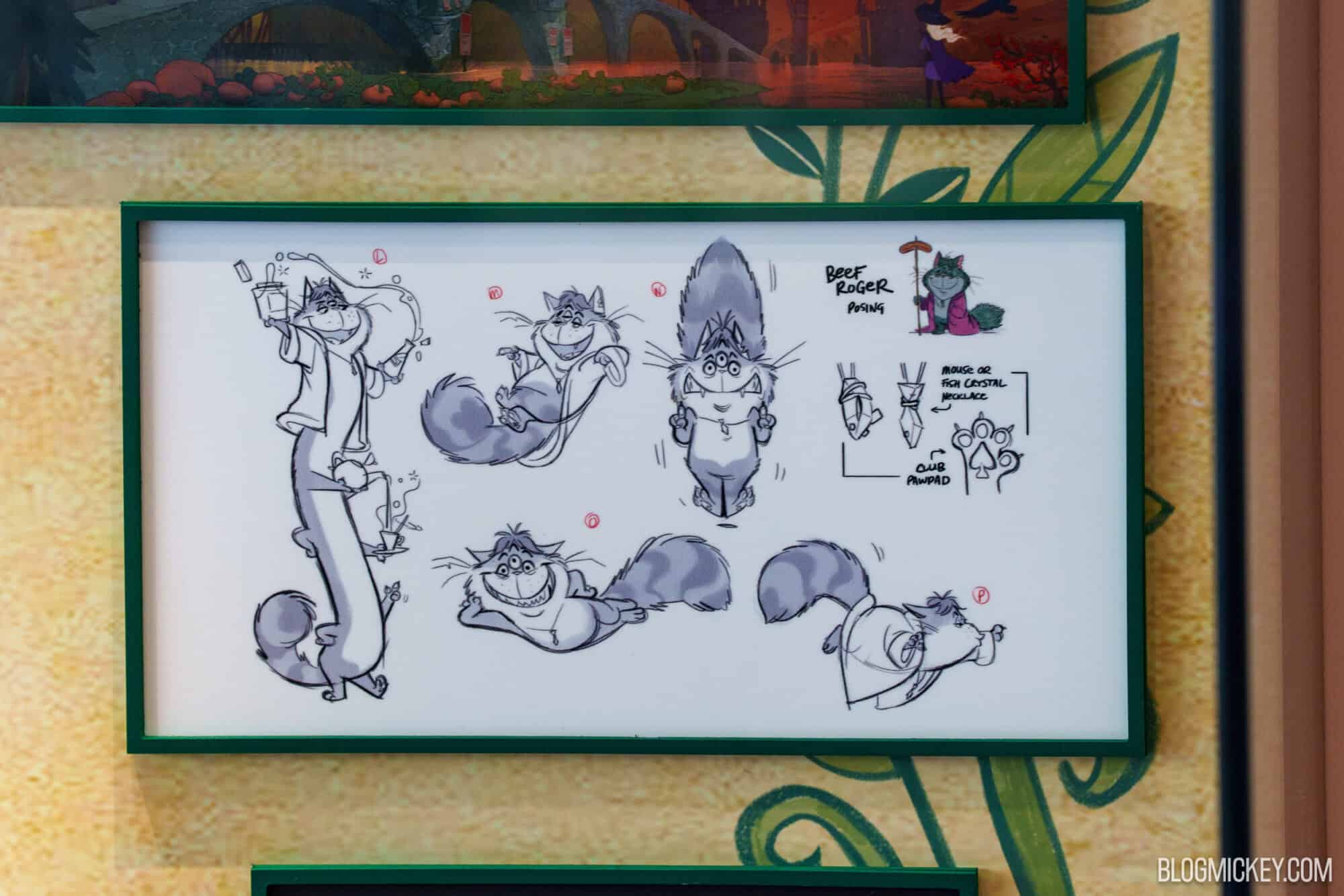 Disney character maquettes on display at Hollywood Studios with sketches.